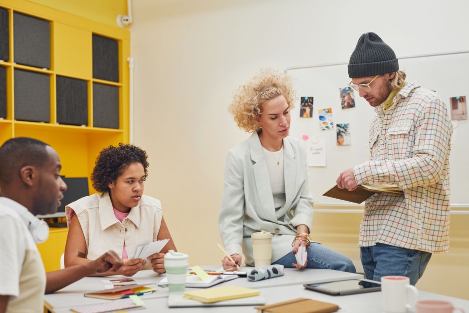 Diverse team brainstorming in a modern office setting, discussing ideas and teamwork